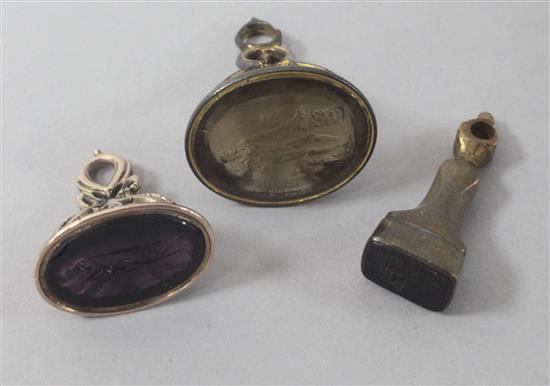 Three assorted seals including one with a purple-coloured intaglio matrix.
